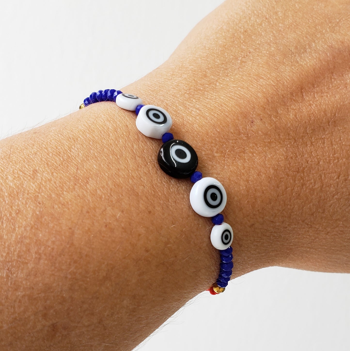 Pulsera ojo cristal color y c. azul